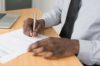 An employer signing a settlement agreement for an employee