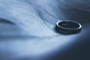 A discarded wedding ring following the breakdown of a marriage.